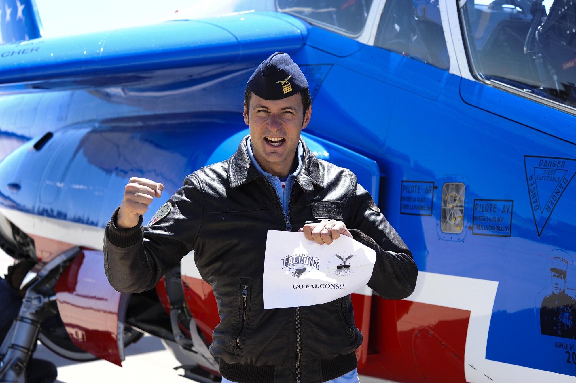 French air force Maj. Nicolas Lieumont, Patrouille France pilot, shows his Falcon spirit after flying over the U.S. Air Force Academy, Colorado, April 19, 2017. Lieumont was an exchange student at the Academy in 2004. (U.S. Air Force photo/Tech. Sgt. Julius Delos Reyes) 