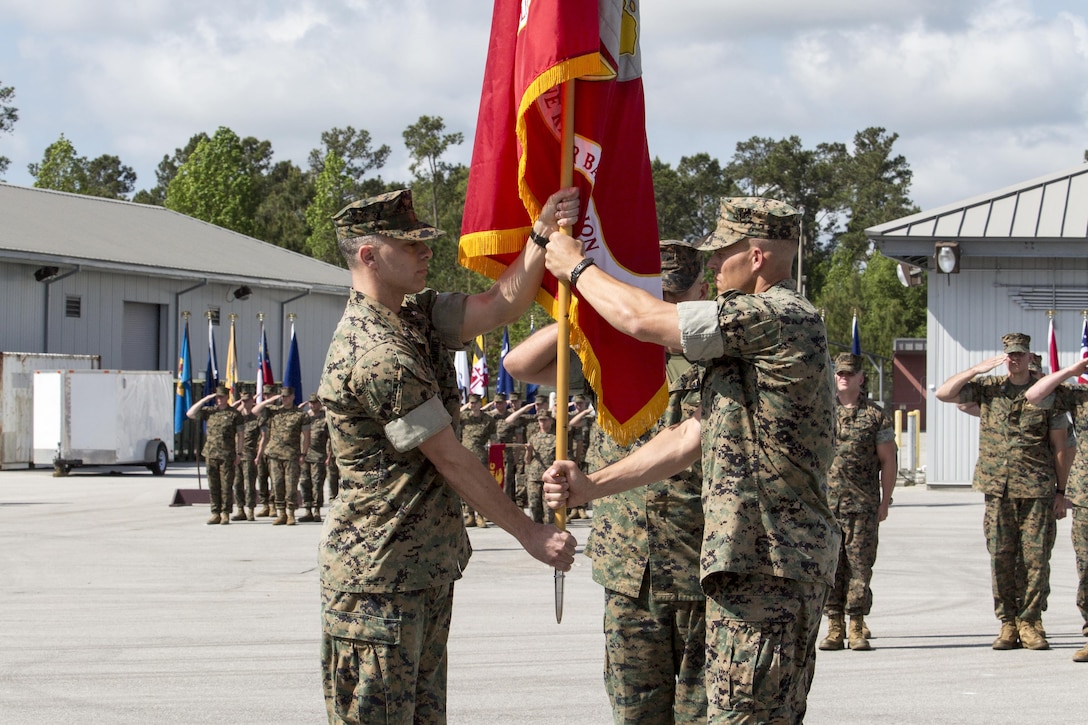 Lt. Col. William L. Lombardo assumes command of 2d Marine Raider Battalion, U.S. Marine Corps Forces, Special Operations Command, from Lt. Col. Craig A. Wolfenbarger during a change of command ceremony aboard Courthouse Bay, Marine Corps Base Camp Lejeune, N.C., April 20, 2017. The exchange of the organizational colors symbolizes Wolfenbarger relinquishing his responsibilities as commanding officer of the battalion to Lombardo.  Lombardo assumes command after serving with MARSOC Headquarters, G-7 Training and Education Branch. (U.S. Marine Corps photo by Sgt. Salvador R. Moreno)