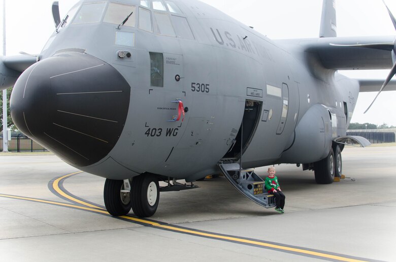 Nathan Heiney, son of Senior Airman Brian Heiney, 403rd Security Forces Squadron and Staff Sgt. Heather Heiney, 403rd Wing Public Affairs, sees a WC-130J Super Hercules aircraft up-close for the first time during the 403rd Wing children's holiday party Dec. 12 at Keesler Air Force Base, Mississippi. (U.S. Air Force photo/Staff Sgt. Heather Heiney)