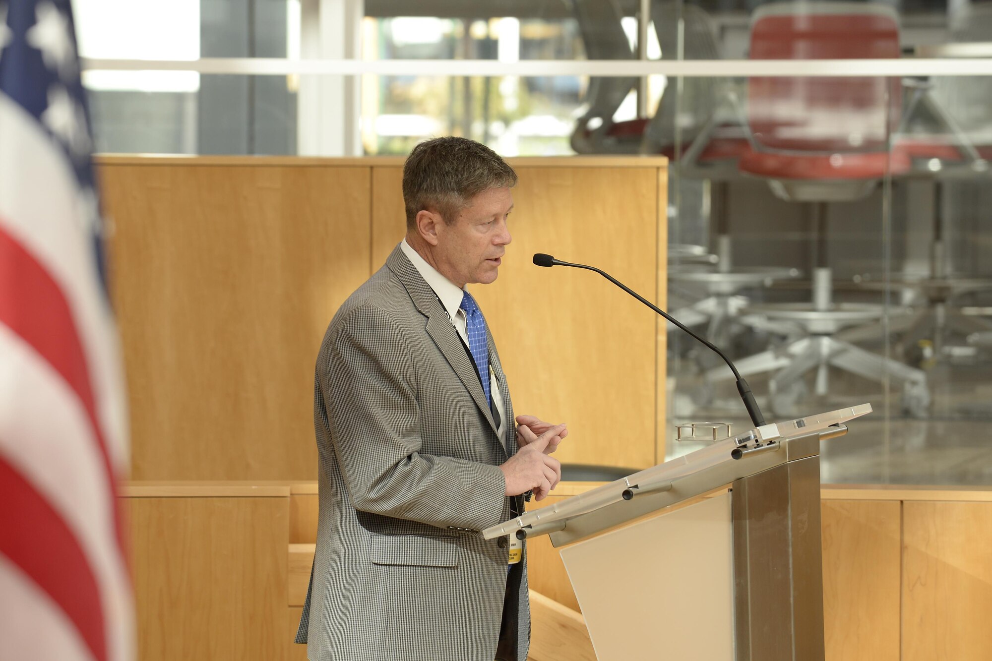 Jim Knowlton, the athletic director at the U.S. Air Force Academy, speaks from the stage of Polaris Hall, April 10, 2017, during the National Association of Collegiate Directors of Athletes Spring Symposium, hosted by the Academy’s Athletic Department. During the two-day symposium, athletic directors from several U.S. colleges met to discuss a shared priority: reducing sexual assault and learning innovative ways to teach leadership and develop character among their athletes. (U.S. Air Force photo/Darcie Ibidapo)