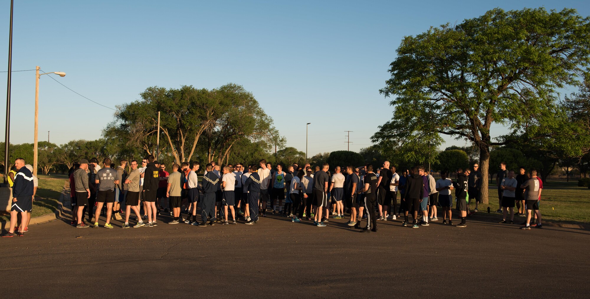 Participants of the Arbor Day and Earth Day 5K fun run gather at the starting line at Unity Park on Cannon Air Force Base, NM, April 19, 2017. The run was just one event in the day in celebration of Arbor Day for the base, which was decreed to be April 19 by Col. Douglas Gilpin, 27th Special Operations Mission Support Group commander. (U.S. Air Force photo by Staff Sgt. Michael Washburn/Released)