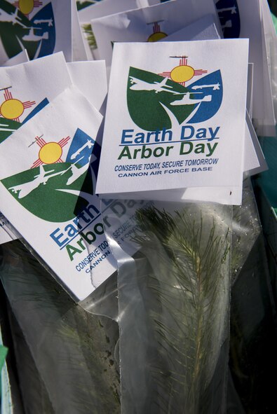 Small Afghan Pine trees sit in bags during the Arbor Day and Earth Day tree planting ceremony at the Youth Center at Cannon Air Force Base, NM, April 19, 2017. The trees, along with t-shirts, were available for anyone to take that came to the ceremony. (U.S. Air Force photo by Staff Sgt. Michael Washburn/Released)