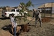 Col. Douglas Gilpin, 27th Special Operations Mission Support Group commander, throws the first mound of dirt during the Arbor Day and Earth Day tree planting ceremony at the Youth Center on Cannon Air Force Base, NM, April 19, 2017. The tree planting was one of three events themed after Earth Day and also Arbor Day, which was decreed to be April 19 at Cannon by Gilpin. (U.S. Air Force photo by Staff Sgt. Michael Washburn/Released)