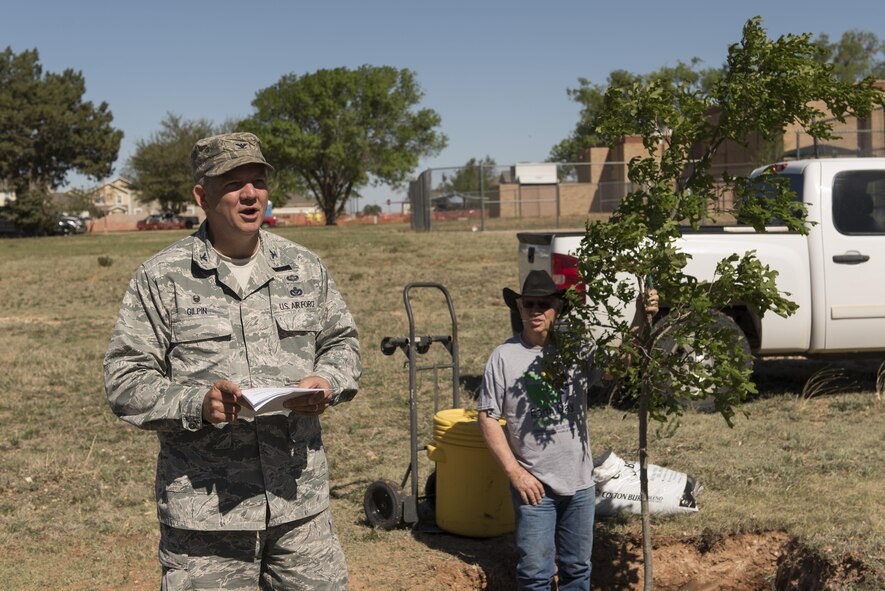Col. Douglas Gilpin, 27th Special Operations Mission Support Group commander, says the closing remarks at the Arbor Day and Earth Day tree planting ceremony at the Youth Center on Cannon Air Force Base, NM, April 19, 2017. Along with the tree planting, Cannon also held a 5K fun run and a recycling center demonstration. (U.S. Air Force photo by Staff Sgt. Michael Washburn/Released)