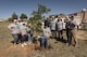 Members of the 27th Special Operations Civil Engineer Squadron Environmental Office pose for a photo after the Arbor Day and Earth Day tree planting ceremony at the Youth Center on Cannon Air Force Base, NM, April 19, 2017. Small Afghan Pine trees, along with t-shirts, were available for anyone to take that came to the ceremony. (U.S. Air Force photo by Staff Sgt. Michael Washburn/Released)