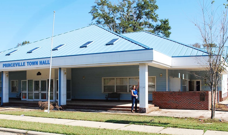 Wilmington District’s Pamela Castens, project manager, pictured at Princeville Town Hall, Princeville, North Carolina, pointing out the high-water mark during flooding from Hurricane Matthew. Princeville was one of the hardest hit areas experiencing catastrophic flooding. The volume of water was so great it took several days to pump it out. (Photo: Courtesy Hank Heusinkveld, Public Affairs Specialist,USACE-Wilmington.)