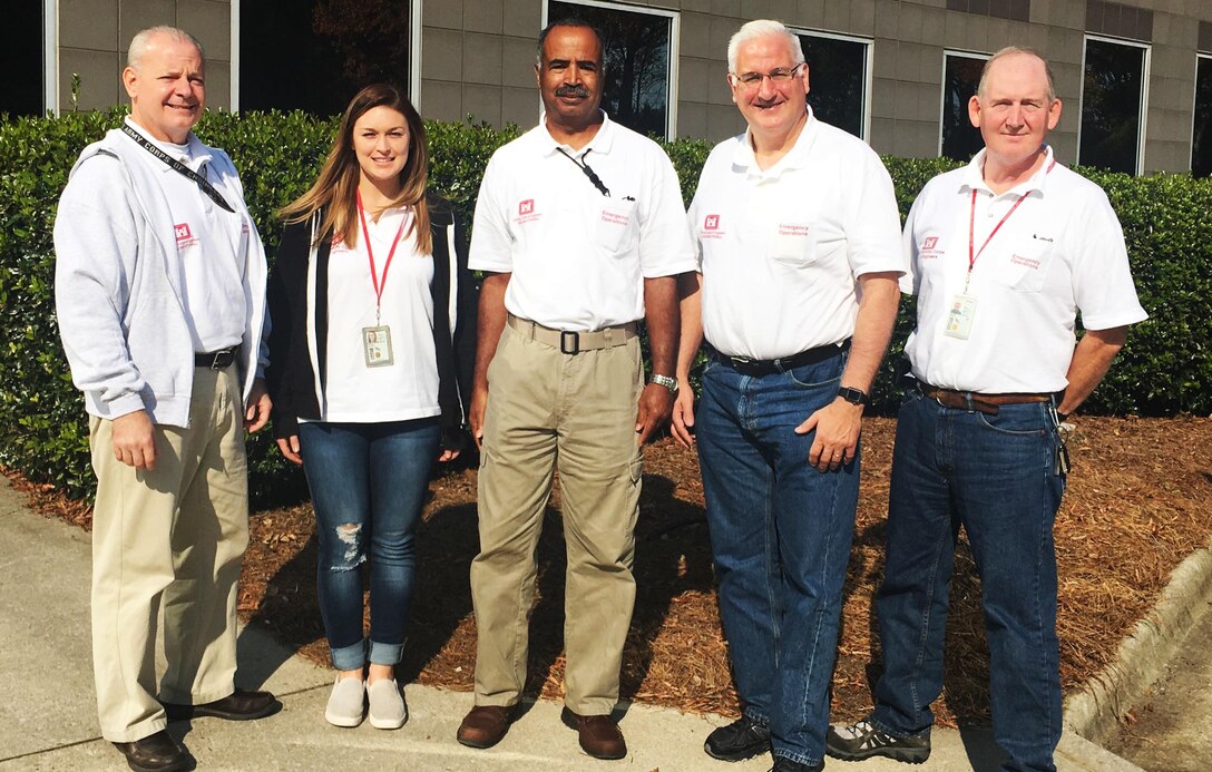 USACE New York and Wilmington staff pictured outside the Joint Field Office in Raleigh, North Carolina, where they provided project management support for the Federal Emergency Management Agency (FEMA) streamlining temporary housing applications for residents displaced by Hurricane Matthew. From L to R: Allen Roos, Kelley Philbin, Anthony Carter, Randall Hintz and James Moore. (Not photographed: Peter Kuglstatter.)