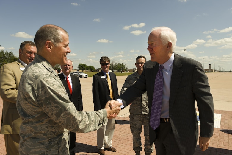 U.S. Sen. John Cornyn, R-TX, shakes hands with Maj. Gen. Thomas Bussiere, 8th Air Force commander, at Dyess Air Force Base, Texas, April 18, 2017. The purpose of the visit was to familiarize the senator with the base and its mission sets, get a glimpse at a day in the life of Team Dyess Airmen and meet with Abilene community leaders. (U.S. Air Force photo by Senior Airman Kedesha Pennant)