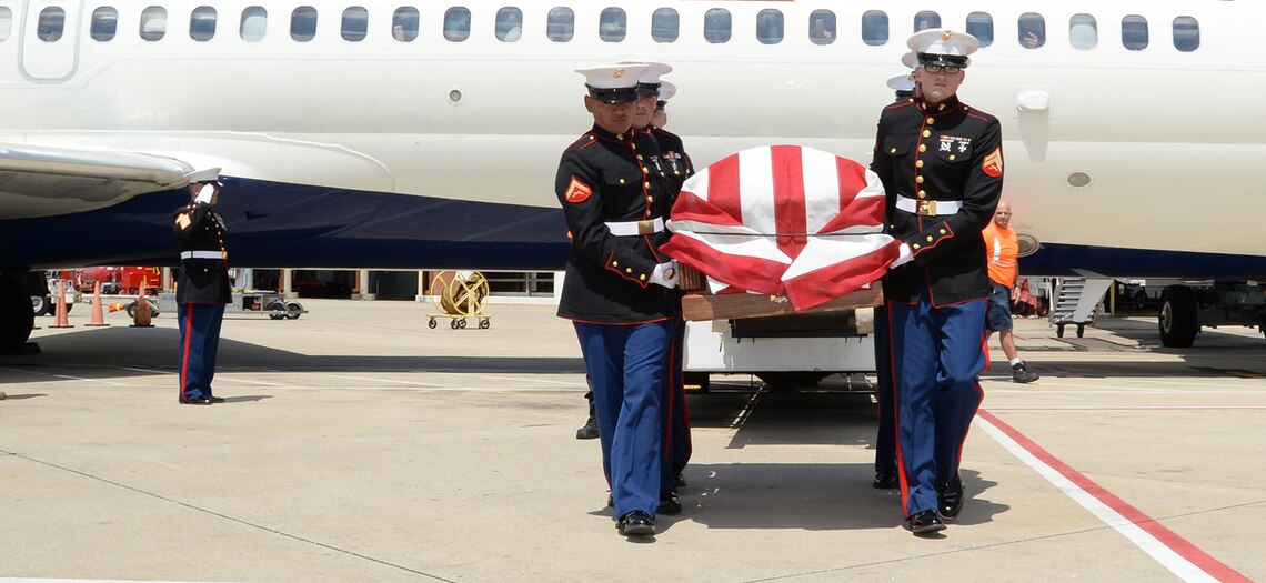 Gunnery Sgt. Melvin G. Ashley, escort, Funeral Detail, Marine Corps Logistics Base Albany, Ga., salutes as Marines carry the remains of fallen Marine Pfc. James O. Whitehurst to an awaiting hearse at the Tallahassee International Airport in Tallahassee, Fla., April 11. Whitehurst was killed in action at the battle of Tarawa during World War II, Nov. 20, 1943. In 2015 a private, non-profit organization known as History Flight excavated what is believed to be Cemetery 27 on the island of Betio, Tarawa, and recovered the remains of multiple individuals, one of them being Whitehurst.  
