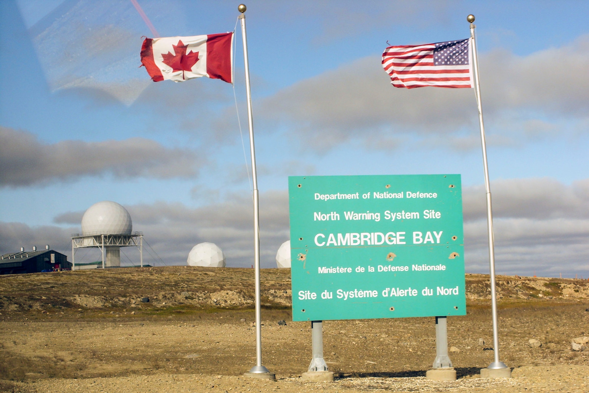 The flags of Canada and the United States fly at the North Warning System Site at Cambridge Bay, Canada. (U.S. Air Force photo/Lanis Williams)