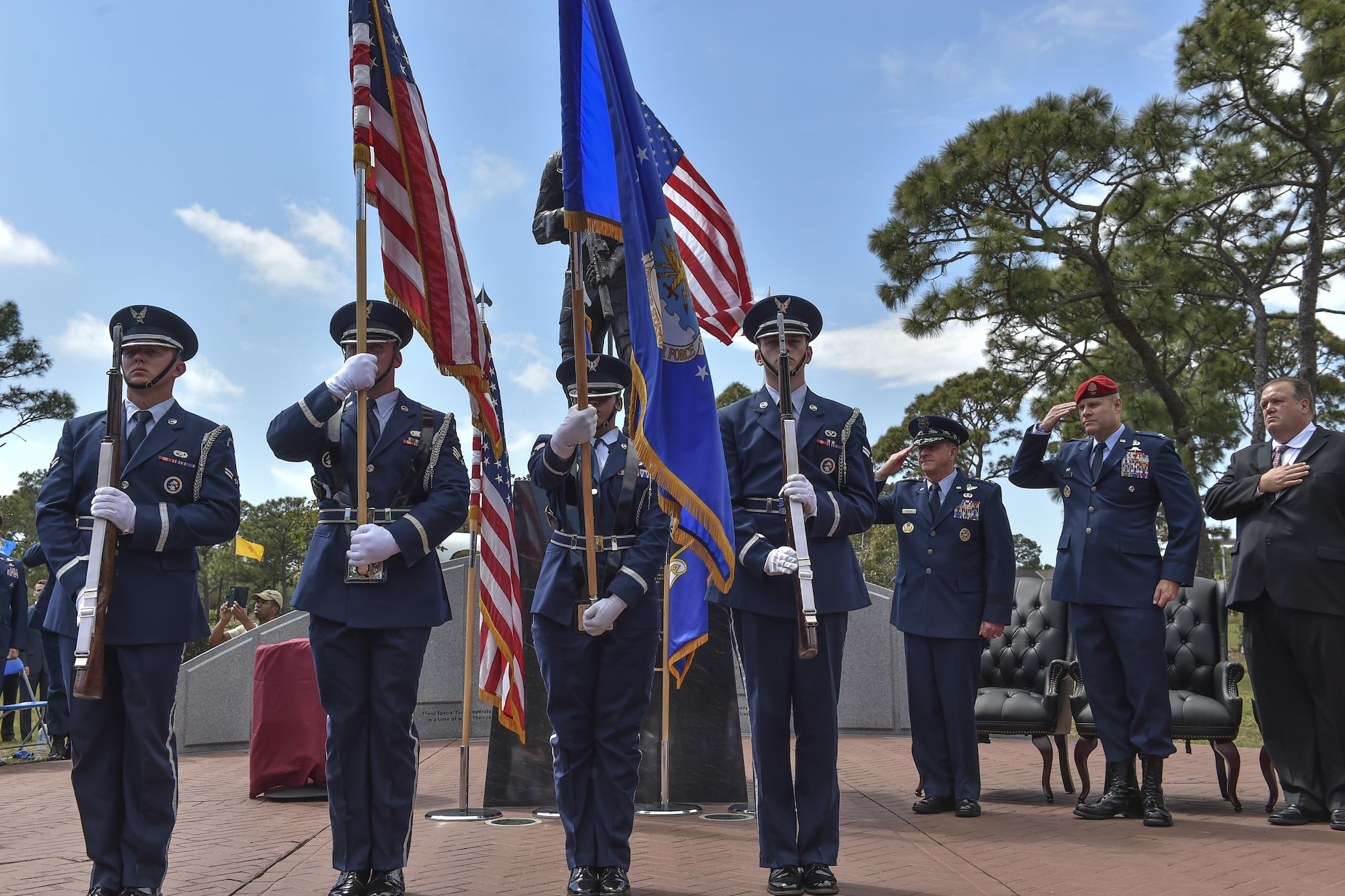 The Hurlburt Field Honor Guard present the colors during a dual Air Force Cross ceremony at Hurlburt Field, Fla., April 20, 2017. For the first time in Air Force history, two Airmen were simultaneously awarded the service’s highest medal for valorous action in combat. Master Sgt. (Ret.) Keary Miller, a retired Special Tactics pararescueman from the Air National Guard’s 123rd Special Tactics Squadron, and Chris Baradat, a combat controller since separated, both received Silver Star medals for their actions in combat, which were upgraded after a service-wide review. (U.S. Air Force photo by Senior Airman Ryan Conroy) 
