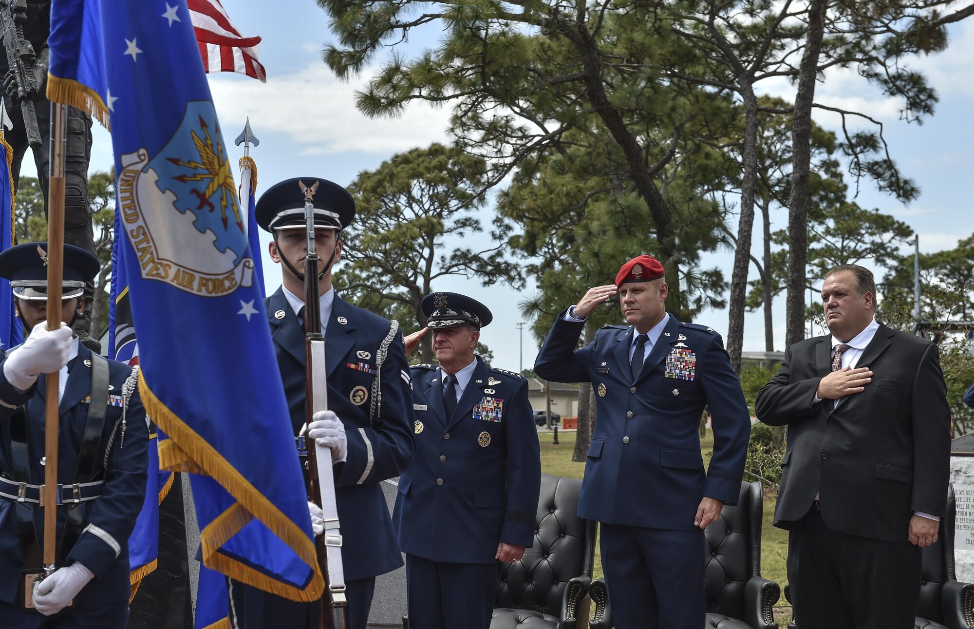 The Hurlburt Field Honor Guard present the colors during a dual Air Force Cross ceremony at Hurlburt Field, Fla., April 20, 2017. For the first time in Air Force history, two Airmen were simultaneously awarded the service’s highest medal for valorous action in combat. Master Sgt. (Ret.) Keary Miller, a retired Special Tactics pararescueman from the Air National Guard’s 123rd Special Tactics Squadron, and Chris Baradat, a combat controller since separated, both received Silver Star medals for their actions in combat, which were upgraded after a service-wide review. (U.S. Air Force photo by Senior Airman Ryan Conroy) 