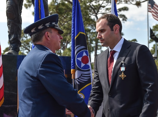 Air Force Chief of Staff Gen. David L. Goldfein  presents Chris Baradat, a former combat controller, the Air Force Cross at Hurlburt Field, Fla., April 20, 2017. Two Airmen were simultaneously awarded the service’s highest medal for valorous action in combat. Retired Master Sgt. Keary Miller, from the Air National Guard’s 123rd Special Tactics Squadron, and Baradat both received Silver Stars for their actions in combat, which were upgraded after a service-wide review.  (U.S. Air Force photo/Senior Airman Ryan Conroy)