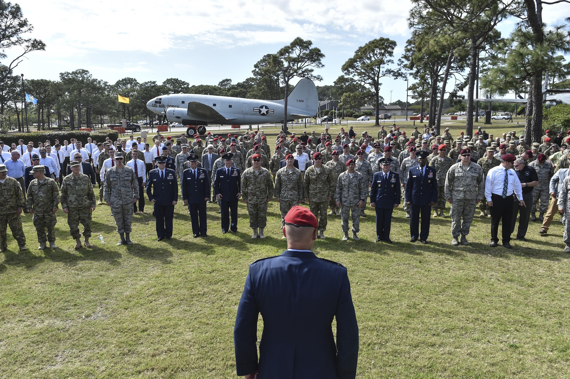 Col. Michael E. Martin, the commander for the 24th Special Operations Wing, calls Airmen to attention to perform "Memorial Pushups" honoring the fallen following a dual Air Force Cross ceremony, April 20, 2017, at Hurlburt Field, Fla. Master Sgt. (Ret.) Keary Miller, a retired Special Tactics pararescueman from the Air National Guard’s 123rd Special Tactics Squadron, and Chris Baradat, a combat controller since separated, both received Air Force Crosses for their actions in combat, which were upgraded from Silver Star medals after a service-wide review. (U.S. Air Force photo by Senior Airman Ryan Conroy) 