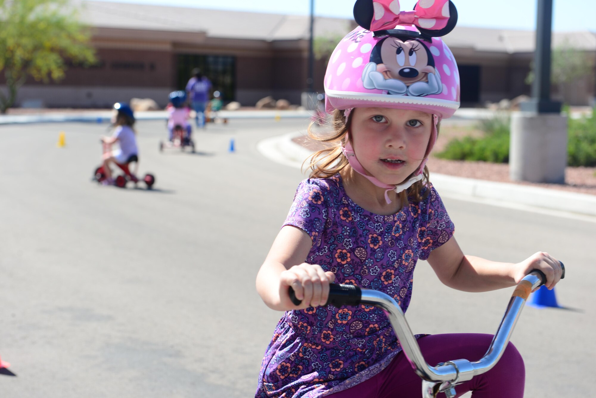 A child rides a tricycle during the trike-a-thon at the Nellis Child Development Center on Nellis Air Force Base, Nev., April 14, 2017. April is designated as the Month of the Military Child and is a way to celebrate the unique aspects of being a military child that most other children outside the military will never have to face. (U.S. Air Force photo by Airman 1st Class Nathan Byrnes/Released)

