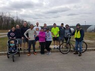 23rd Space Operations Squadron members prepare for the Arbor Day/Earth Week Fun Run at New Boston Air Force Station, New Hampshire, Wednesday, April 19, 2017. New Boston personnel were also invited to take part in a base trash pick-up effort, preparing different locations on-site for springtime. (Courtesy photo)   