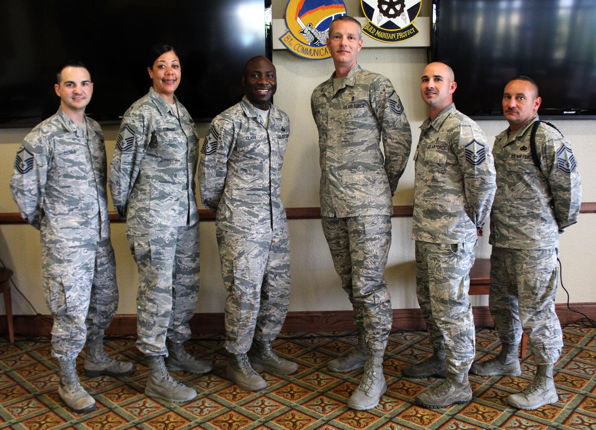 Members of the Keesler Top III executive council pose for a photo with Chief Master Sgt. Vegas Clark, 81st Training Wing command chief, after a meeting April 12, 2017, at the Bay Breeze Event Center on Keesler Air Force Base, Miss. Top III meetings take place the second Wednesday of the month at 3:30 p.m. in the BBEC’s third floor Dragon’s Lair. 