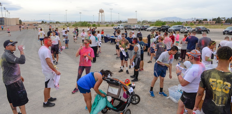 Airmen and their families gather at the finish line after the 5k Color Run/Walk, April 7, 2017, at Nellis Air Force Base, Nev. The 5k Color Run/Walk was open for all Department of Defense ID holders to participate in. (U.S. Air Force photo by Airman 1st Class Andrew D. Sarver/ Released)


