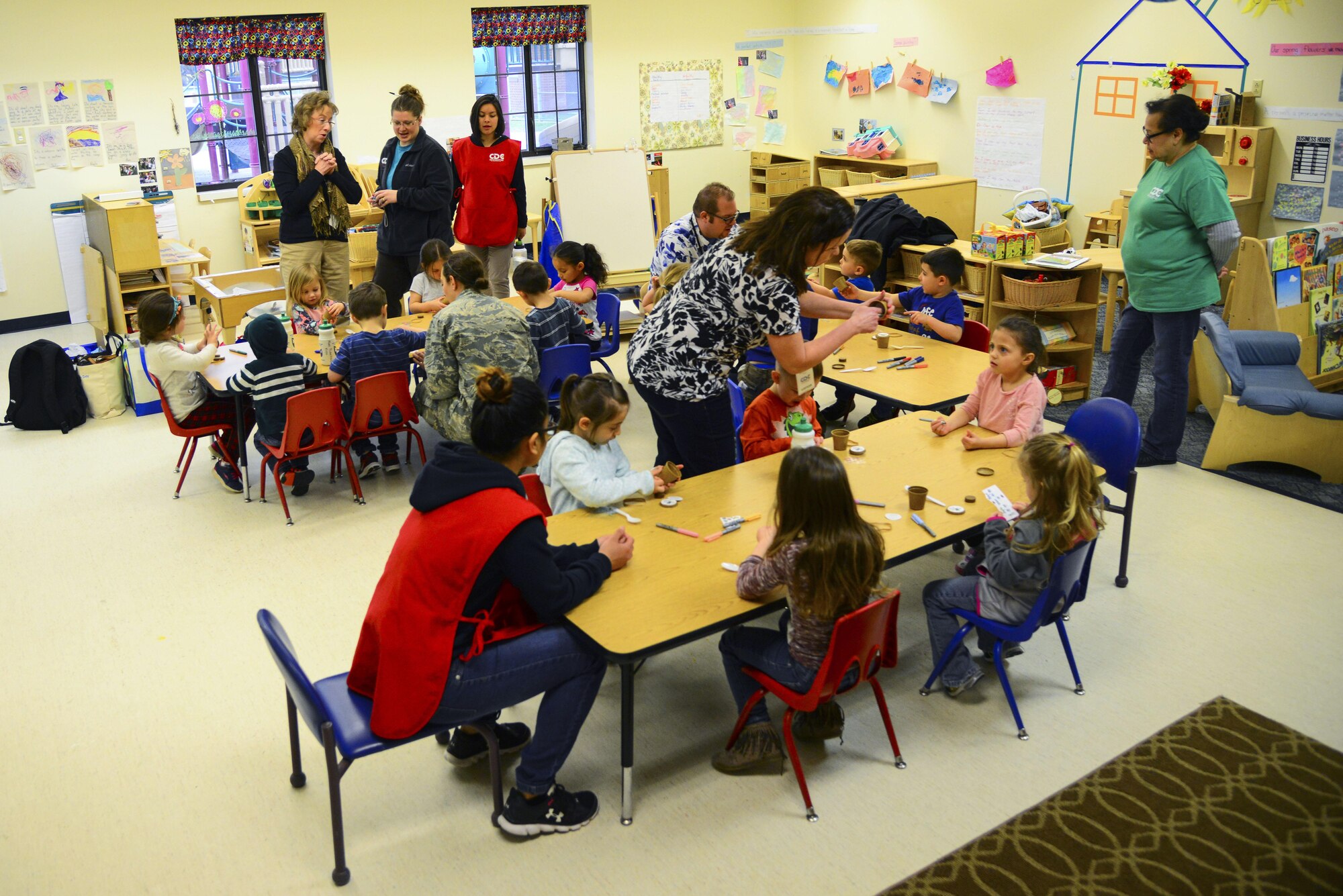 Representatives from the 92nd Civil Engineer Squadron teach kids how to plant their own seeds in a mini planter as part of the Earth Day celebration at the Child Development Center Apr. 20, 2017, at Fairchild Air Force Base, Washington. The Air Force will also be celebrating its 70th anniversary this year, with innovation, teamwork and heritage being the key themes. All of which are relevant to how the base protects and sustains the environment while completing the mission. (U.S. Air Force photo/Senior Airman Janelle Patiño)