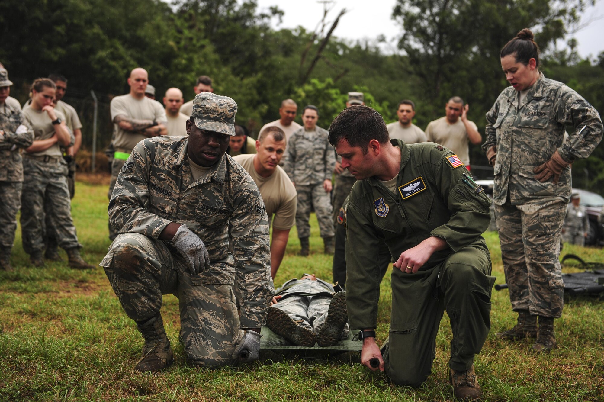 Airmen from across Hickam Field practice litter carries during the hands on self-aid buddy care lessons for Exercise TROPIC THUNDER 2017 (XTT17), at Wheeler Army Airfield, Hawaii, April 20, 2017.  XTT17 is a two part full spectrum readiness exercise hosted by the 15th Wing to test the individual, organizational and expeditionary readiness of the Airmen stationed at Joint Base Pearl Harbor-Hickam. (U.S. Air Force photo by Tech. Sgt. Heather Redman)