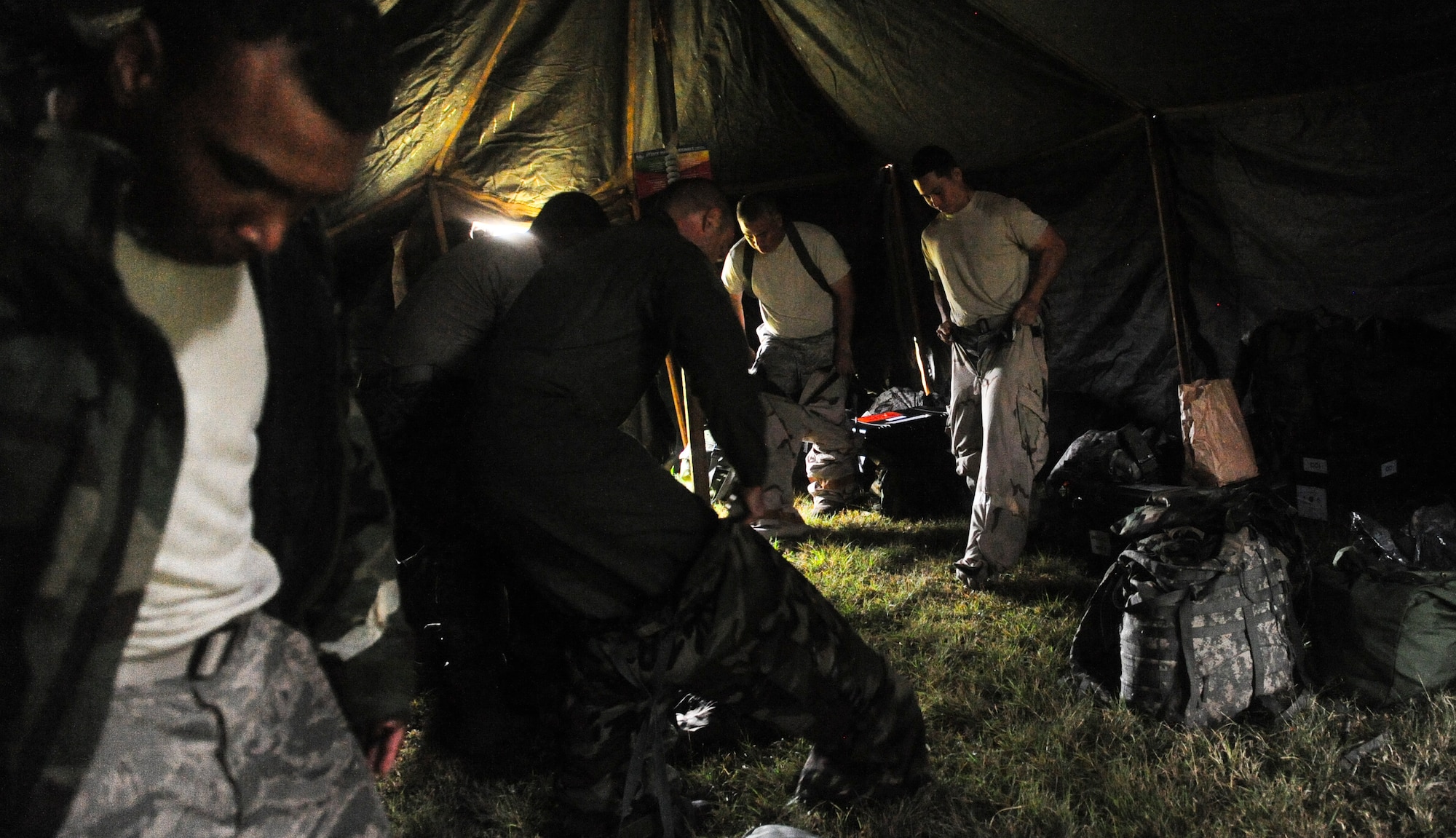 Airmen stationed at Hickam Field don their Mission Oriented Protective Posture (MOPP) gear for an exercise scenario during Exercise TROPIC THUNDER 2017 (XTT17), at Wheeler Army Airfield, Hawaii, April 20, 2017.  XTT17 is a two part full spectrum readiness exercise hosted by the 15th Wing to test the individual, organizational and expeditionary readiness of the Airmen stationed at Joint Base Pearl Harbor-Hickam. (U.S. Air Force photo by Tech. Sgt. Heather Redman)