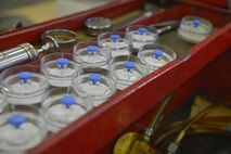 Single weight monitors sit in a box in the fuel laboratory at Yokota Air Base, Japan, April 19, 2017. The monitors are used to field test the fuel to provide visual indication of contamination. (U.S. Air Force photo by Staff Sgt. David Owsianka)