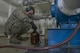 Staff Sgt. David Carson, 374th Logistics Readiness Squadron fuels laboratory NCO in charge, fills a container with a cumulative sample of JP8 fuel from 12 tank cars at Yokota Air Base, Japan, April 19, 2017. The lab ensures the fuel is clean, isn’t mixed with other types of fuel and meets the standards the military puts out. (U.S. Air Force photo by Staff Sgt. David Owsianka)