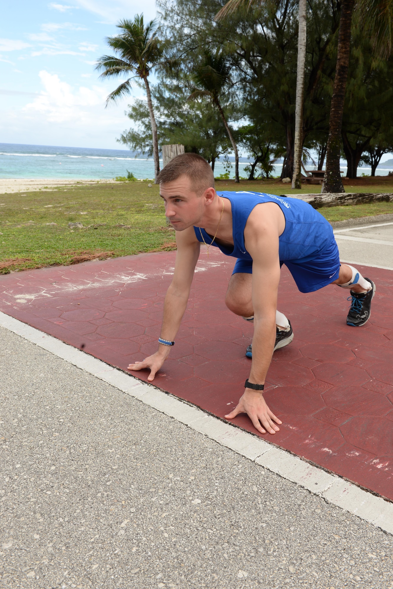 Second Lt. Ryan Novack, the 36th Munitions Squadron flight leader, prepares to run at Andersen Air Force Base, Guam, March 1, 2017. Novack was a victim of a serious spinal injury from riding dirt bikes, resulting in him being paralyzed below the knees. After attending months of physical therapy, he returned to work and is currently conditioning for the Defense Department Warrior Games this summer in Chicago. (U.S. Air Force photo by Senior Airman Cierra Presentado)