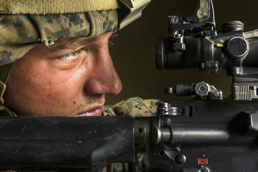 A Marine provides security during a simulated amphibious assault on Red Beach at Camp Pendleton, Calif., April 13, 2017. The Marine is assigned to Battalion Landing Team 1st Battalion, 5th Marine Regiment, 15th Marine Expeditionary Unit. Marine Corps photo by Cpl. Frank Cordoba