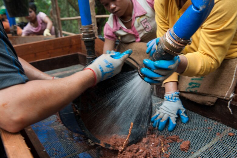 U.S. Army Sgt. Lee Ritterbeck, 303D Explosive Ordnance Disposal Battalion communications NCO, works with citizens of the Lao People’s Democratic Republic to clean out a wet screen station March 16, 2017, in the Khommouon province in the country of Laos. The purpose of a wet screen station is to sift through excavated sediment to locate material evidence and possible osseous material. The mission of DPAA is to provide the fullest possible accounting for our missing personnel to their families and the nation.  (U.S. Air Force photo by Senior Airman Lynette M. Rolen/Released)