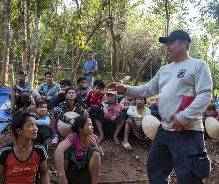 U.S. Army Staff Sgt. Franois Sangiamvongse, Defense Prisoner of War/Missing in Action analyst and Lao linguist, speaks with citizens of the Lao People’s Democratic Republic March 24, 2017, in the Khommouon province in the country of Laos. Partnerships with different countries guarantee mission continuity with DPAA of returning America’s missing heroes home. The mission of DPAA is to provide the fullest possible accounting for our missing personnel to their families and the nation. (U.S. Air Force photo by Senior Airman Lynette M. Rolen/Released)