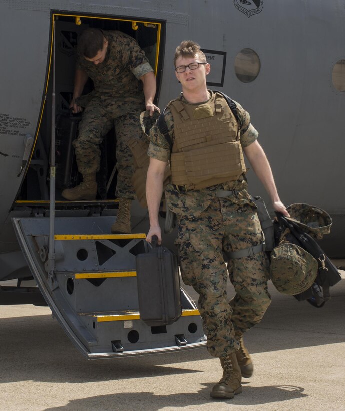 U.S. Marine Corps Lance Cpl. Jeffrey Tschirhart, an aviation operations specialist with Marine Attack Squadron (VMA) 311, and Sgt. Albert Ludwig, a nondestructive inspection technician with Marine Aviation Marine Aviation Logistics Squadron (MALS) 12, arrive at Kunsan Air Base, Republic of Korea, April 12, 2017. MALS 12 and VMA 311 are participating in Exercise MAX THUNDER 17, an operational readiness exercise built to promote interoperability between U.S. and ROK forces. This annual exercise helps to promote stability in the Asia-Pacific region. (U.S. Marine Corps photo by Lance Cpl. Carlos Jimenez)