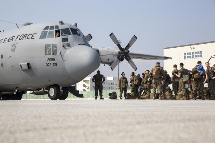 U.S. Marines with Marine Attack Squadron (VMA) 311 board a C-130 Hercules during an exercise to Kunsan Air Base, Republic of Korea, from Marine Corps Air Station Iwakuni, Japan, April 12, 2017. VMA 311 is participating in Exercise MAX THUNDER 17, an operational readiness exercise built to promote interoperability between U.S. and ROK forces. This annual exercise helps to promote stability in the Asia-Pacific region. (U.S. Marine Corps photo by Lance Cpl. Carlos Jimenez)