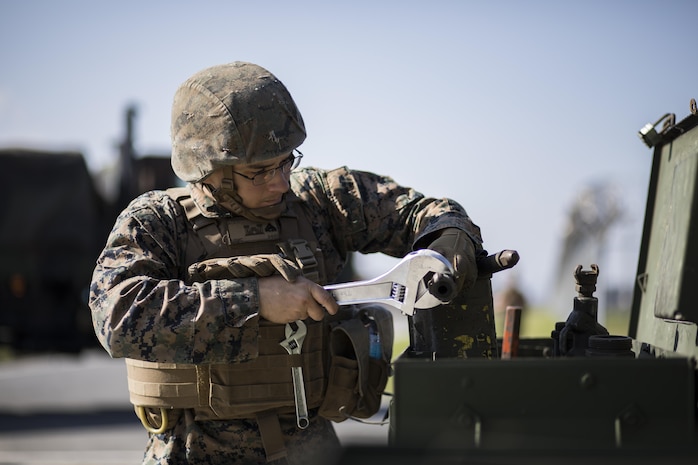 U.S. Marine Corps Cpl. Jeffrey Aceti, a combat engineer with Marine Wing Support Squadron (MWSS) 171, maintains equipment used during airfield damage and repair training at Marine Corps Air Station Iwakuni, Japan, April 19, 2017. The ADR training required Marines to utilize their skill set to tactically and proficiently fix any anomalies to a simulated damaged airfield. The training focused on becoming more efficient in situations that may require Marines to act in real-world scenarios to maintain the tempo of aircraft operations. (U.S. Marine Corps photo by Lance Cpl. Joseph Abrego)