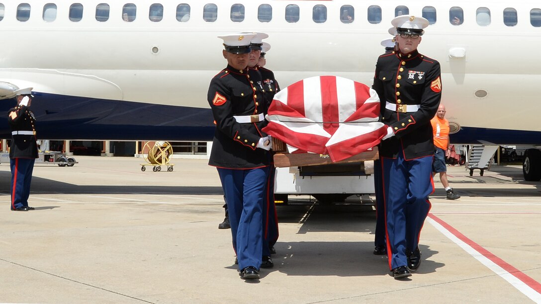 Gunnery Sgt. Melvin G. Ashley, escort, Funeral Detail, Marine Corps Logistics Base Albany, Ga., salutes as Marines carry the remains of fallen Marine Pfc. James O. Whitehurst to an awaiting hearse at the Tallahassee International Airport in Tallahassee, Fla., April 11. Whitehurst was killed in action at the battle of Tarawa during World War II, Nov. 20, 1943. In 2015 a private, non-profit organization known as History Flight excavated what is believed to be Cemetery 27 on the island of Betio, Tarawa, and recovered the remains of multiple individuals, one of them being Whitehurst.