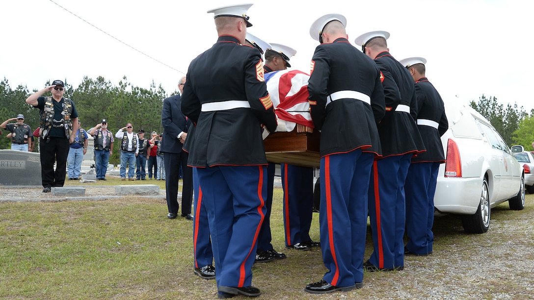 Gunnery Sgt. Melvin G. Ashley (center) escort, and Marines with Marine Corps Logistics Base Albany Funeral Detail, carry the remains of fallen Marine Pfc. James O. Whitehurst from a hearse to his final resting place at Cowarts Baptist Church Cemetery in Cowarts, Ala., April 12. Whitehurst was killed in action while fighting the Japanese at the battle of Tarawa during World War II, Nov. 20, 1943. In 2015 private, non-profit organization known as History Flight excavated what is believed to be Cemetery 27 on the island of Betio, Tarawa, and recovered the remains of multiple individuals, one of them being Whitehurst.