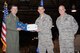 Staff Sgt. Caley Cramer, center, a vehicle maintenance technician with the 55th Logistics Readiness Squadron at Offutt Air Force Base, Nebraska, stands with Col. Marty Reynolds, left, 55th Wing commander, and Command Chief Master Sgt. Michael Morris, right, command chief of the 55th Wing, moments after Reynolds revealed to Cramer he had been step promoted to staff sergeant April 3, 2017. Cramer had been two weeks from beginning terminal leave after reaching higher tenure last year.
