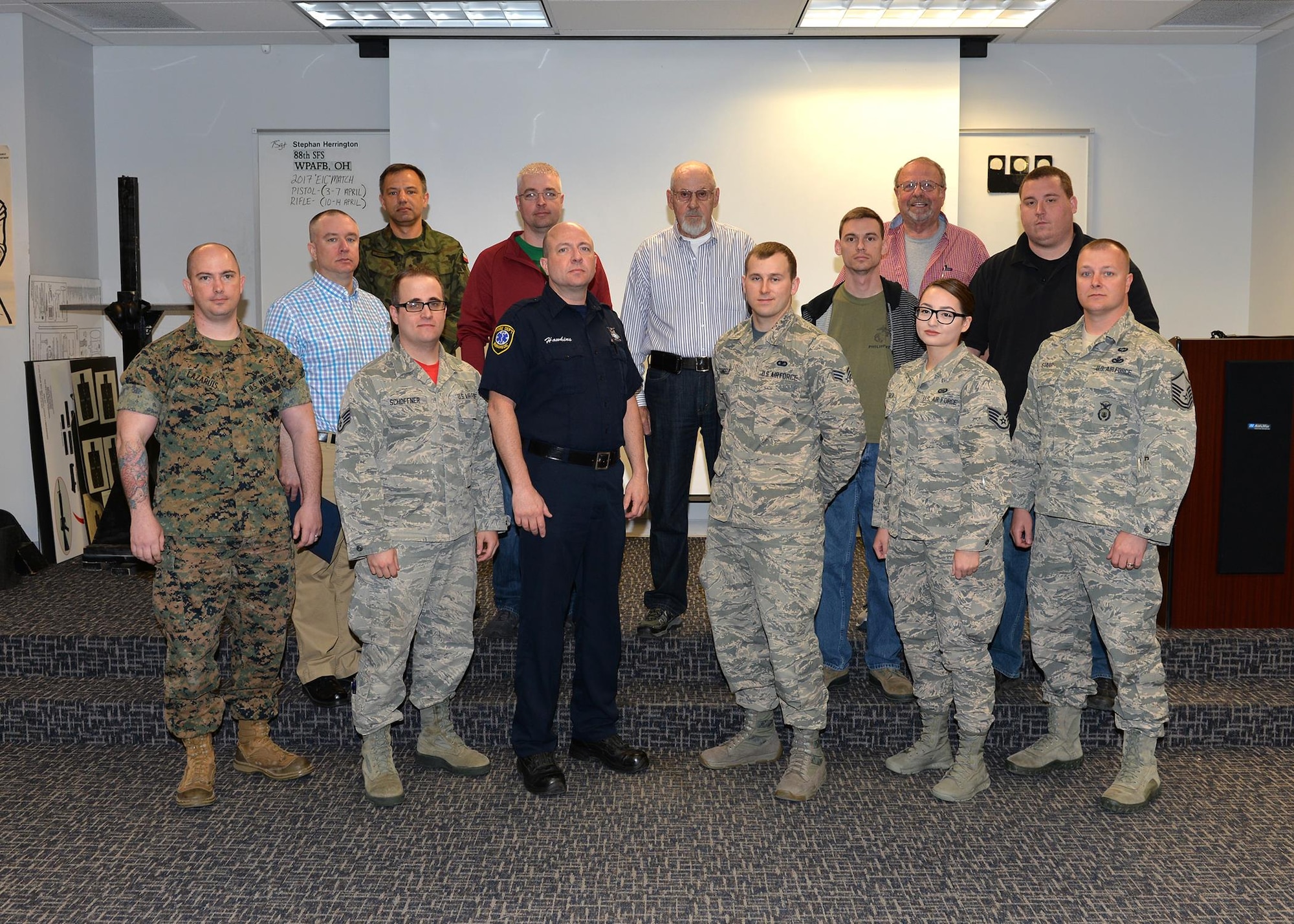 The Wright-Patterson Air Force Base top 10 percent performers during the Excellence in Competition firearms marksmanship contest are recognized at an awards ceremony held at the 88th Security Forces Squadron gun range April 14, 2017. The EIC competition held across all Department of Defense installations provides military members, civilian employees and retirees the opportunity to refine their marksmanship skills, competing against each other in pursuit of earning marksmanship awards eligible for wear on the uniform or civilian attire. (U.S. Air Force photo/Al Bright)