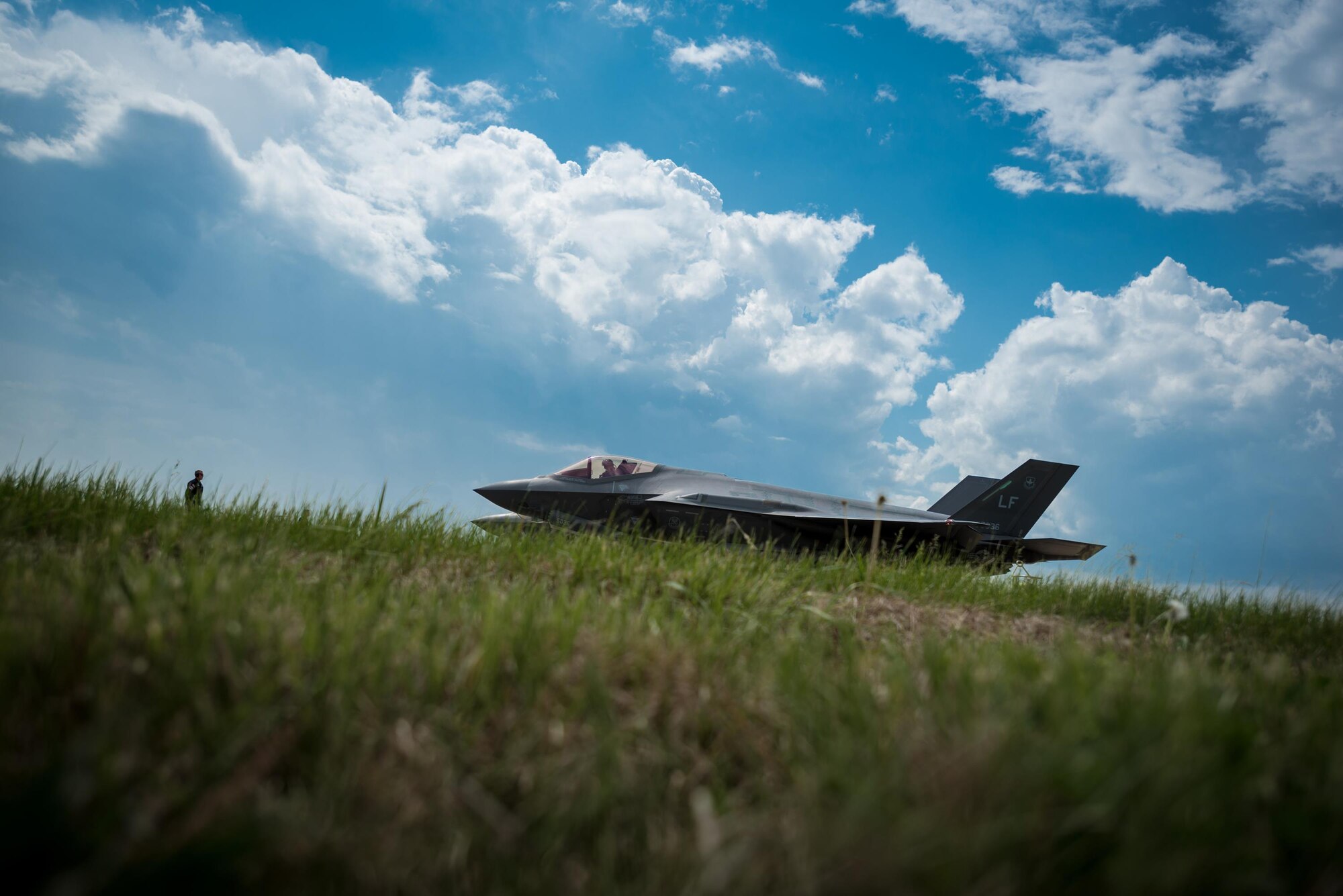 A U.S. Air Force crew chief marshals an F-35 Lightning II aircraft on the flight line of the Kentucky Air National Guard Base in Louisville, Ky., April 20, 2017. The F-35, which is in town to perform in the Thunder Over Louisville air show on April 22, is the Air Force's newest fighter jet. (U.S. Air National Guard photo by Lt. Col. Dale Greer)