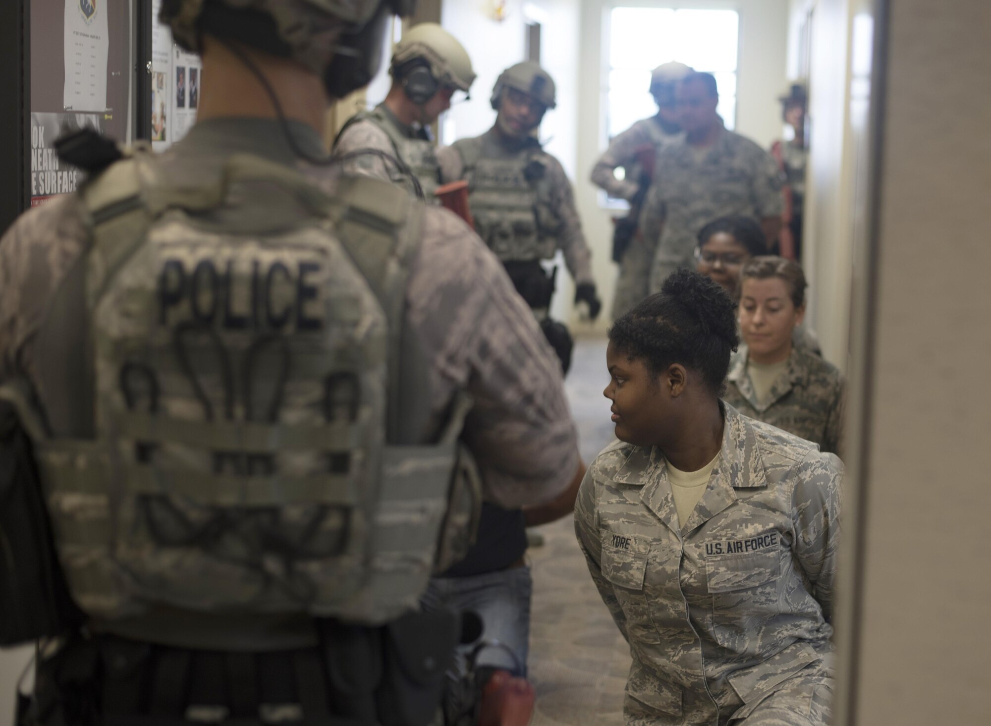 Members of the 927th Air Refueling Wing are detained by Airmen assigned to the 6th Security Forces Squadron (SFS) during an active shooter exercise, April 17, 2017 at MacDill Air Force Base, Fla. After the shooter was controlled, members of the 6th SFS cleared rooms to evacuate all personnel. (U.S. Air Force photo by Airman 1st Class Adam R. Shanks)