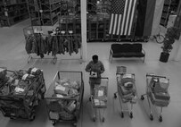 Staff Sgt. Martha Otto, 86th Logistics Readiness Squadron training manager, organizes equipment on Ramstein Air Base, Germany, Feb. 21, 2017.  Otto, fled her South-Sudanese home at the age of seven in search of safety from Joseph Kony’s Lord Resistance Army and spent most of her childhood in a refugee camp. Today, she is passionate about sharing her perilous journey to help others. (U.S. Air Force photo by Staff Sgt. Nesha Humes)