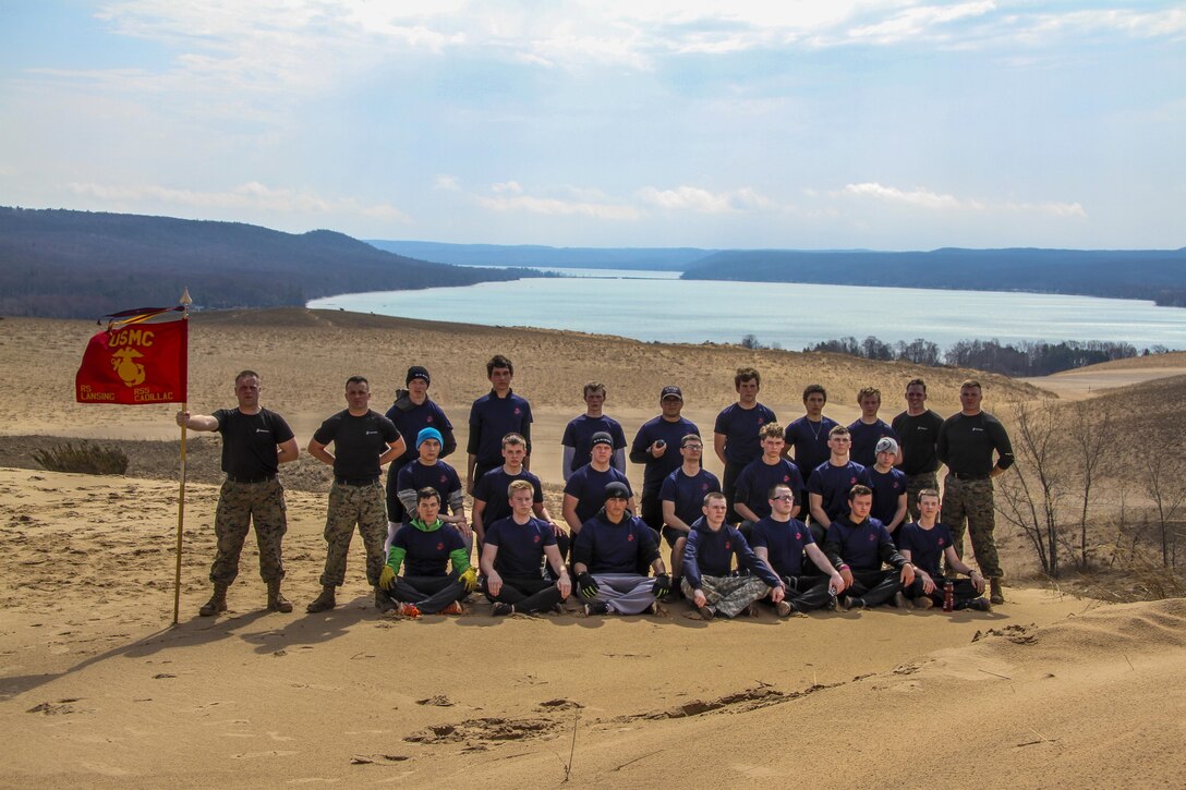 Future Marines pose for a photo with Marine Corps recruiters from Recruiting Sub-Station Cadillac at the Sleeping Bear Dunes National Lakeshore, Empire, Michigan, April 15, 2017. During the five-mile hike, the team rehearsed Marine Corps terminology as well as prepared for the physical demands of Marine Corps Recruit Depot, Parris Island, South Carolina. (U.S. Marine Corps photo by Sgt. Immanuel M. Johnson/Released)