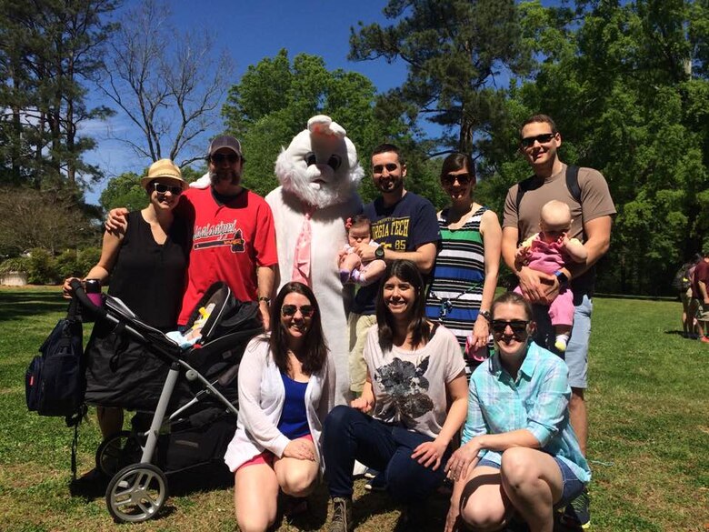 ERDC team members and their families pose during the WES-ERDC Castle Club Easter Basket Raffle and Easter Egg Hunt event April 1.