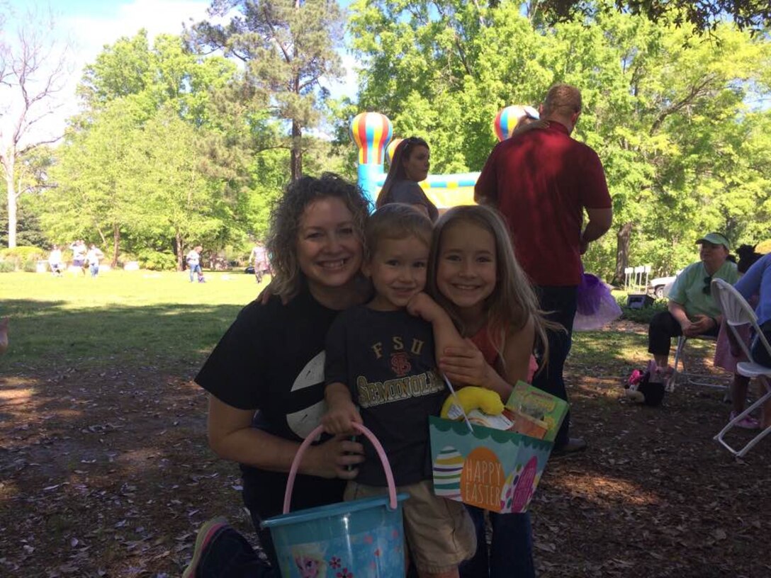 Stacy Tennison pose with her son Jacob, a golden egg winner, and daughter Ellie, during the WES-ERDC Castle Club Easter Basket Raffle and Easter Egg Hunt event April 1.