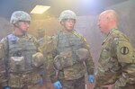 Maj. Gen. Glen Moore (right), deputy commanding general, Army National Guard, U.S. Army Training and Doctrine Command, speaks with Army students in the combat medic training program at the Medical Education and Training Campus at Joint Base San Antonio-Fort Sam Houston April 14. Moore observed the students as they trained in the Combat Trauma Patient Simulator, a simulation lab that provides a realistic type of training experience for students learning how to treat trauma wounds on casualties in a combat environment. About half of the students in the combat medic training program are in the National Guard or Army Reserve.