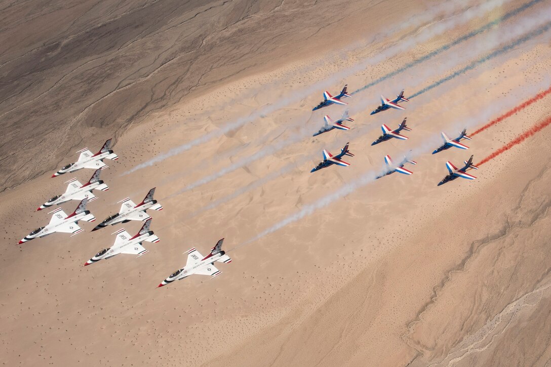 The United States Air Force Thunderbirds and Patrouille de France fly together over Death Valley, Calif., April 17, 2017. The Thunderbirds and Patrouille de France are two of the oldest aerial demonstration teams in the world. (U.S. Air Force Photo by Tech. Sgt. Christopher Boitz)