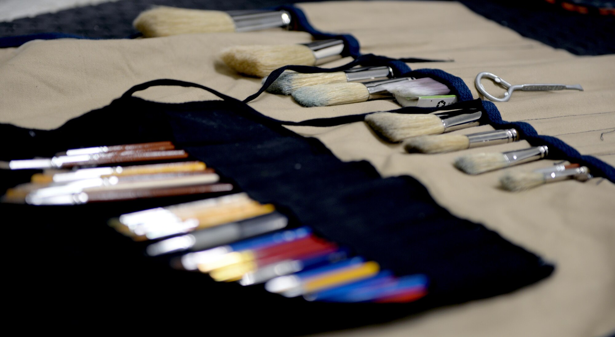 Paint brushes are laid out during a painting project at the Gunter Air Force Base Gym, April 14, 2017. The murals were created by Ian Mangum, a Family Camp reservation specialist with the 42nd Force Support Squadron. His artwork is a collaboration of famous and iconic boxers from past to present. (U.S. Air Force photo/Senior Airman Tammie Ramsouer)