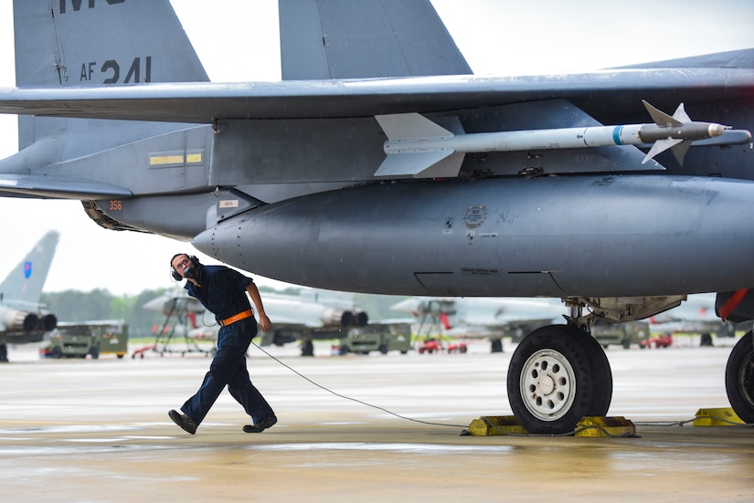 A U.S. Air Force crew chief from the 366th Aircraft Maintenance Squadron performs final inspections on an F-15E Strike Eagle assigned to Mountain Home Air Force Base, Idaho, during ATLANTIC TRIDENT 17 at Joint Base Langley-Eustis, Va., April 18, 2017. The Air Force conducts major joint exercises to rehearse and enhance warfighting skills. (U.S. Air Force photo/Airman 1st Class Anthony Nin Leclerec)