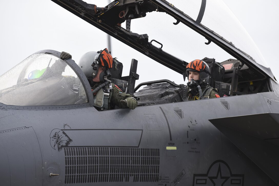 A U.S. Air Force F-15E Strike Eagle pilot and weapon systems officer assigned to the 391st Fighter Squadron at Mountain Home Air Force Base, Idaho, check their communication systems during ATLANTIC TRIDENT 17 at Joint Base Langley-Eustis, Va., April 18, 2017. The exercise demonstrates the U.S.’s heritage of aerial excellence with French and Royal air force allies in the skies. (U.S. Air Force photo/Airman 1st Class Anthony Nin Leclerec)