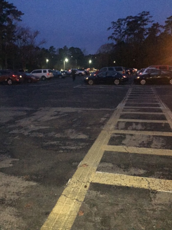 Building 159 had a dimly lit parking lot before Voluntary Protection Program initiatives that took place aboard Marine Corps Air Station Cherry Point, N.C., in December 2015. “We avoided a potential injury thanks to VPP fostering a culture of safety,” said Bob Dockery, a supply systems analyst aboard the air station.  In VPP, management, labor, and the Occupational Safety and Health Administration work cooperatively and proactively to prevent fatalities, injuries, and illnesses through a system focused on: hazard prevention and control; worksite analysis; training; and management commitment and worker involvement. (Courtesy photo/ Used with Permission)